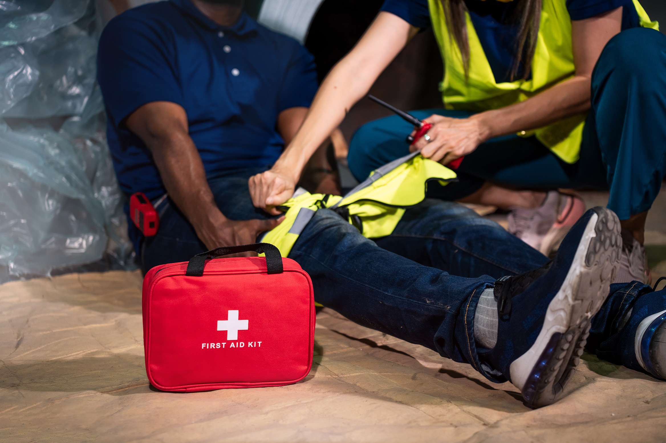 Emergency,Staff,In,Safety,Suit,Help,A,Man,Who,Has
