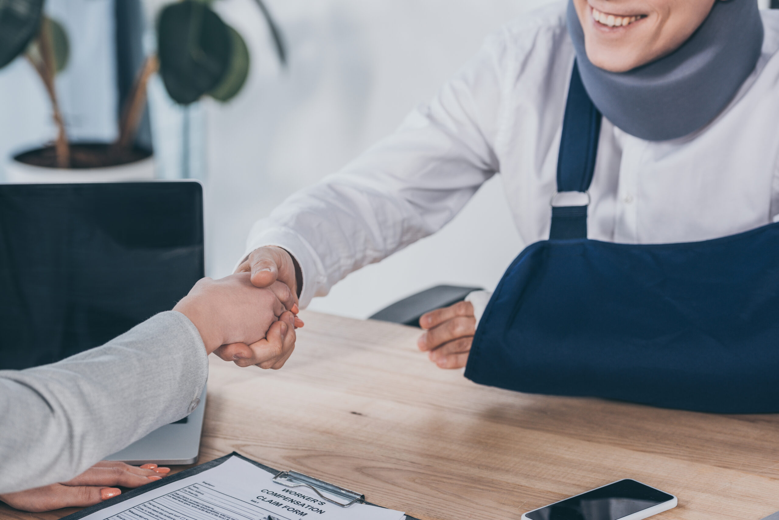 Cropped,View,Of,Woman,Shaking,Hands,With,Worker,In,Neck